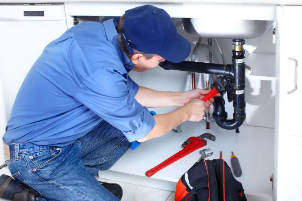 a male plumber fixing a toilet from Emergency Plumber Grand Prairie in Grand Prairie, TX 
